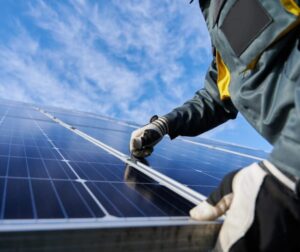 solar installation in Devon carried out by a man in PPE