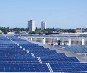 Rows of solar panels on a commercial roof
