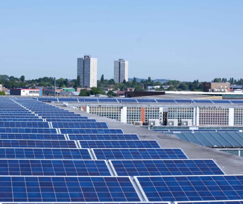 Rows of solar panels on a commercial roof