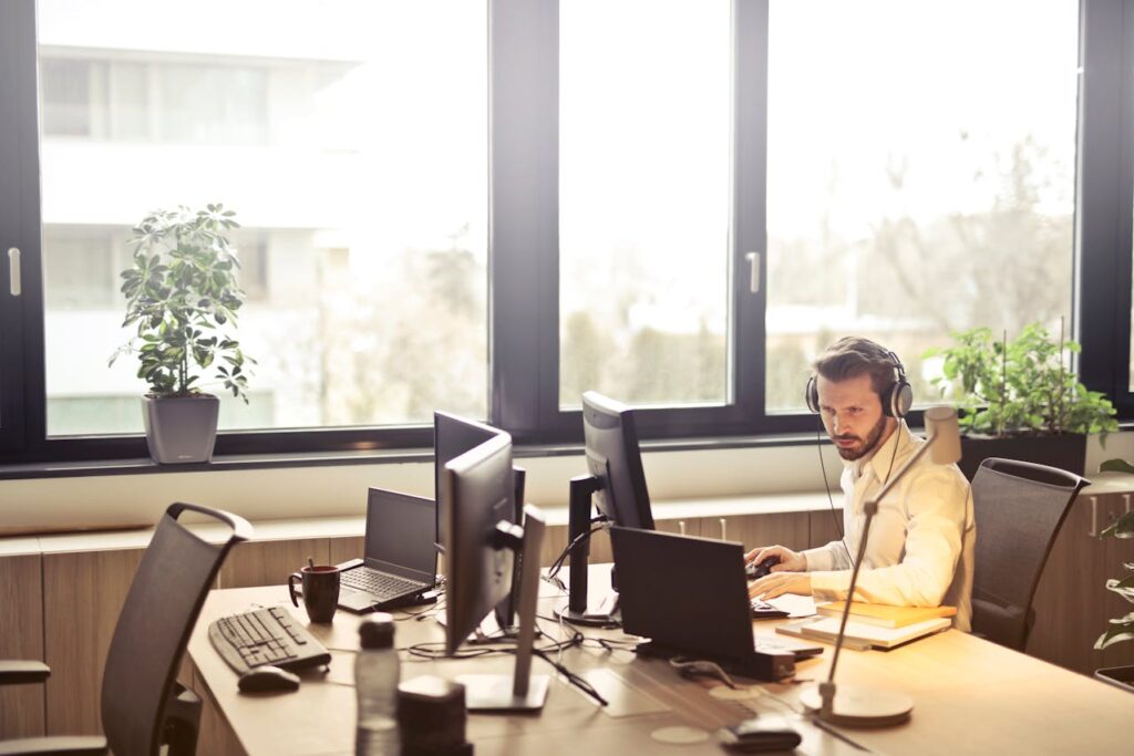 man working on office computer
