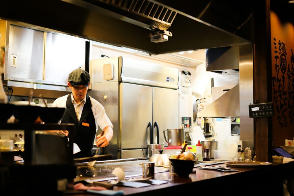 chef in open commercial kitchen