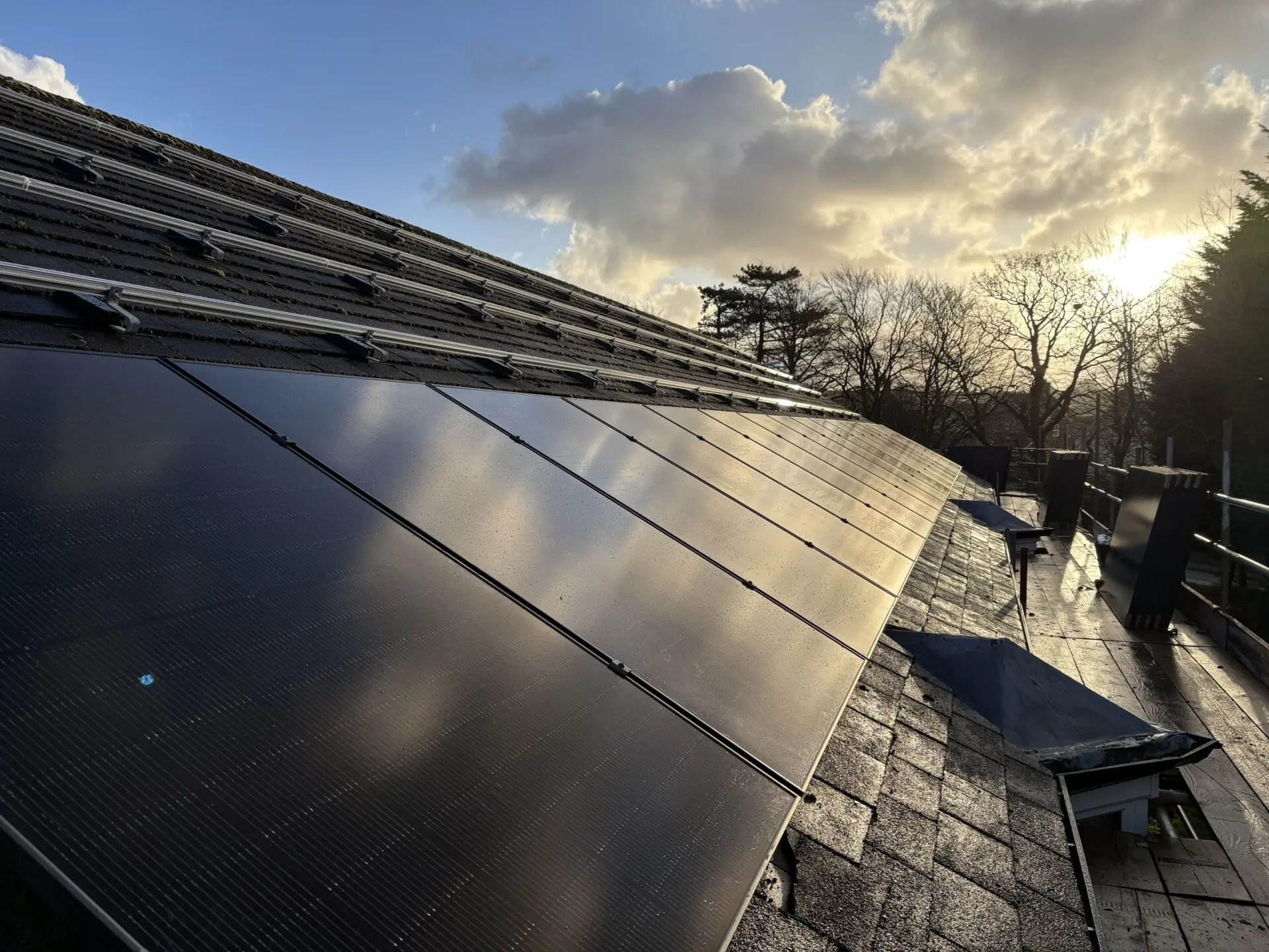 single row of solar panels mid way through installation