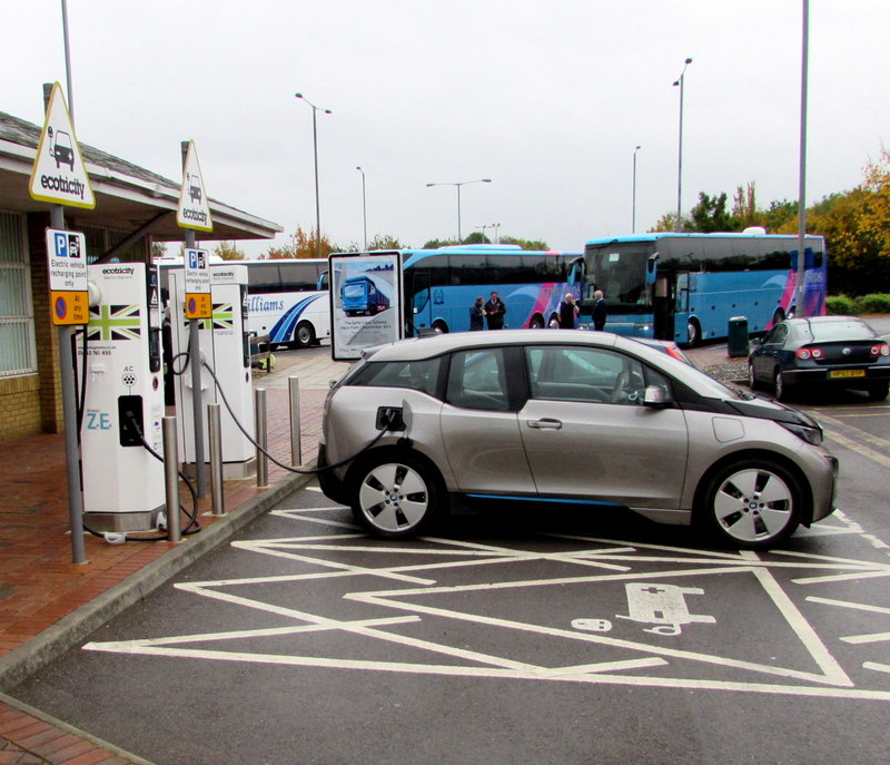 recharging an electric car at service station