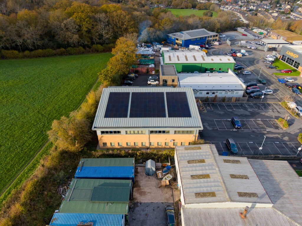 three solar panel installations on roof on commercial building