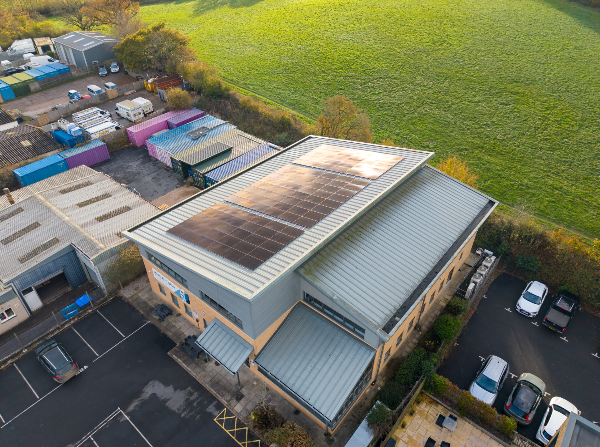 three sets of solar panels on top of commercial roof
