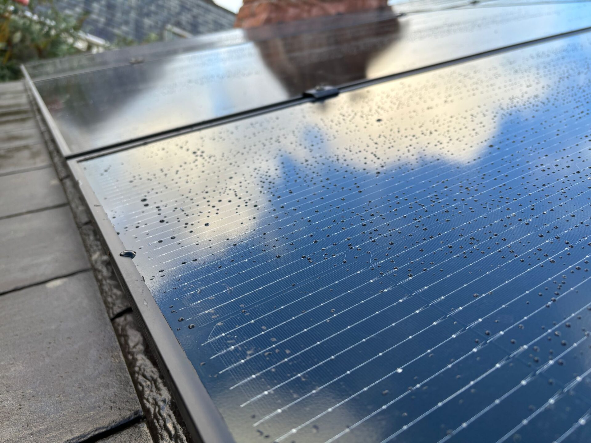 close up of solar panels with rain droplets