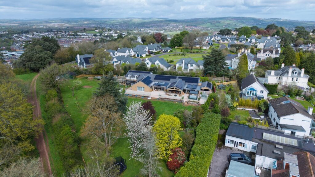 MCS accredited solar panel installers on roof in Newton Abbot